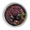Tapenade - olive paste made from black olives. Spreadable black olive cream in  bowl isolated on white
