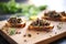 tapenade spread on crostinis on rustic wooden board