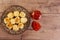 Tapioca dice served with pepper jelly. Wooden table