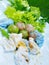 Tapioca dumplings with lettuce and bird pepper on white plate