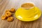 Tarallini, black coffee in cup on saucer on wooden table