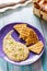 Taramasalata and pita grill on a ceramic violet plate top view