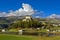 Tarasp Castle rising above lake Taraspsee