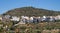 Tarbena,terraced hillside outside the town with row of characteristically whitewashed houses with terra cotta tile rooftops