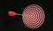 Target with arrow in bullseye hitting the target. Black background. 3D Render