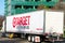 Target delivery semi trailer truck with a slogan expect more, pay less is driving on the narrow street