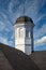 Tarnished Cupola on Roof Under Blue Skies