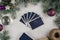 Tarot cards fanned back up on white concrete surface with Christmas tree branches and decor. Minsk, Belarus, 19.11.2021