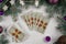 Tarot cards fanned back up on white concrete surface with Christmas tree branches and decor. Minsk, Belarus, 19.11.2021