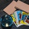 Tarot cards and magic ball on wooden background. Mystical and divination concept