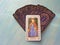 Tarot cards medieval close up with russian title The Empress Tarot Decks on blue wooden background