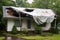 tarp covering large hole in storm-damaged roof