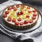 Tart with cherry tomatoes, cheese and onions on aluminum baking dish. From series Healthy Eating