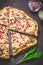 Tart flambee Flammkuchen with ramson sour cream, onion and bacon