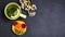 Tart with kiwi, orange and cherry isolated on dark background, shale board. top view, space for text