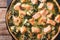 Tart with red fish, spinach and herbs in baking dish close up on