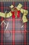 Tartan background texture with polka dots and yellow ribbon