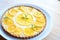 tarte au citron with a creamy swirl, candied lemon atop