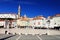 Tartini Square is the main square of Piran. The belltower of St. George`s Church and The Franciscan monastery in background