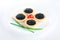 Tartlet with black caviar on a white platter