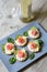 Tartlet with cream cheese, cucumber and slightly salted trout