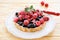 Tartlet with fresh raspberries and currants