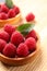 Tartlet with fresh raspberries on wooden table, closeup and space for text. Delicious dessert