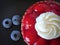 Tartlet with strawberries and whipped cream, close up