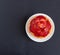 Tartlet with vanilla cream covered with slices of strawberry.