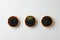 Tartlets with black caviar on white background, top view