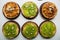 Tartlets with caramel and nuts. Delicious appetizing tarts with kiwi on a white background