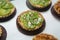 Tartlets with caramel and nuts. Delicious appetizing tarts with kiwi on a white background