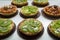 Tartlets with caramel and nuts. Delicious appetizing tarts with kiwi on a white background