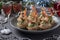 Tartlets with crab sticks, cheese and shrimps in the New Year`s composition. Delicious festive snack. Closeup