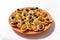 Tartlets with cream cheese, shrimps and black olives, decorated with kumquat.