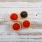 Tartlets filled with red and black caviar against rustic wooden background