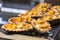 Tartlets with fresh bananas on a black tray