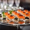 Tartlets with red caviar and black caviar close up. Gourmet food, delicacy appetizer. Delicatessen. Texture of caviar. Seafood and