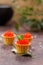 Tartlets with red caviar. Holiday concept. Still life with greenery decor. Close-up