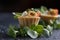 Tartlets with salmon and cheese cheese with micro-green on a dark background.