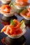 Tartlets with salmon, cream and a slice of lemon.