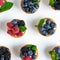 Tartlets with soft cheese and berries of raspberry, blackberry, blueberry. Delicious and healthy desserts. Photo of