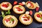 Tartlets with strawberries, banana, mint, close-up