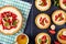 Tartlets and tart with strawberries, banana, mint