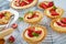 Tartlets and tart with strawberries, banana, mint