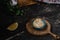 Tartlets with whipped cream, with lemon, coffee americano, wooden basket and green leaves