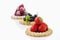 Tarts with blueberries, strawberries and raspberries