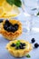 tarts with lemon cream and blueberries.