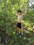 TARZAN - Cute boy showing off strength in forest