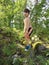 TARZAN - Cute boy showing off strength in forest